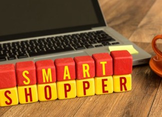 Smart Shopper written on a wooden cube in a office desk